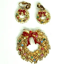 Beautiful gold tone and colored stone wreath pin brooch with matching clip earrings.
