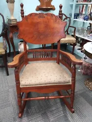 Carved back wooden rocker with upholstered seat. Despite this rocker having been around for quite a few years, it is a...