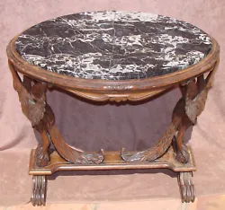 The table’s finish is original. The marble top shows signs of having been repaired. This table i s available for...