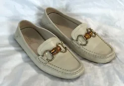 They are in amazing pre-loved condition with a lot of wear left. the color is a bright Bone/Ivory. Only minor wear...