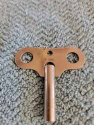 Antique Key for a German Kienzle Clock. Key has the numbers 9 450 marked on top. Key is in good condition. A great find...