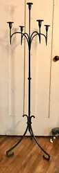 Wrought Iron Floor Candelabra. Three Legs attached to a central column, supporting five lights, four mounted on...