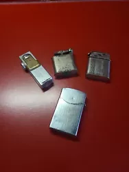 lot de 4 anciens briquets essence A remettre en fonction  Complets voir photos Dans leur jus, vendu tel que sur photos...
