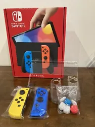 Nintendo Console Nintendo Switch (Modèle OLED) avec Manettes Joy-Con Bleu Néon/Rouge Néon (utilise 3 fois) fourni...