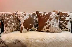 The pillow cover is made with Genuine Cowhide / Cow skin with Hair on Skin. Natural Cowhide Hair on one side and Black...