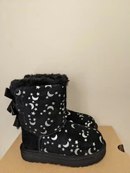These are an authentic pair of Ugg Australia. Treadlite by UGG™ outsole for comfort. Woven heel label with UGG®...