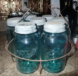 There are 6 Blue Green Ball Perfect Mason Jars and 1 Brockway clear jars.
