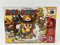 Mario Party 2 (Nintendo 64). Shrink wrap is in fair condition. There are two tears on the front next to the bottom edge...