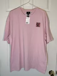 H&M Keith Haring short sleeve T Shirt with smiley face graphic print. Pink shirt, red and black artwork. Size Large,...