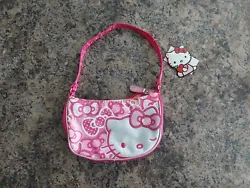 This charming pink purse is the perfect accessory for any Hello Kitty enthusiast. Featuring the beloved Sanrio...