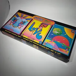 Three 500 Piece Jigsaw Puzzles. 3 Unique Peter Max Art Designs. New, Sealed Box. See Photos.