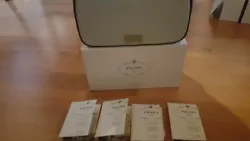 Infusion DIris. Prada Milano Satin Travel Case. Made exclusively for Prada Parfums.05fl oz/1.5ml Spray Sample. • Let...