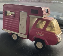Vintage 1970s Tonka Pink Camper Truck Pressed Steel. See pictures for condition. Has sliding back window and plastic...