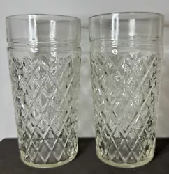 This lot of two vintage diamond quilt pattern glass tumblers is a must-have for any collector of mid-century modern...