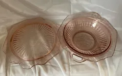 This pink depression glass handled 10 inch vegetable or serving bowl and footed 10 inch cake plate are stunning pieces...
