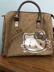 Hello kitty brown satchel. Canvas W/ Large HK Motif. Spacious W/2 pockets. 12x11.