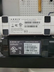 Two cable modems with power supplies.  Upgrade your home networking with these high-quality ARRIS cable modems. Enjoy...