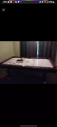 This pool table also double as a hockey foosball table theres no felt or cues but it has balls still a great buy for...