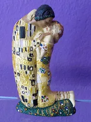 This is a small size sculpture entitled The Kiss (1907) by Gustav Klimt. The powerful bond between man and woman (c....