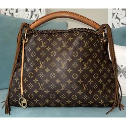 AuthenticLouis Vuitton Artsy MM Shoulder Monogram Canvas Hobo Bag. The hardware hanging from the tassle and the...