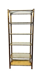 An iconic mid century masterwork.  You are bidding on item pictured.  Authenticity guaranteed.Faux bamboo etagere...