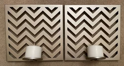 2 gold Chevron metal wall accents that hold candles. CANDLES NOT INCLUDED. Wall accents are in great condition. Size is...