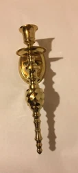 If hanging, it sticks out from the wall approx. This candleholder stands 10” tall, and the oval base 3.75