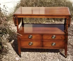 Pick up only. The server has brass accents on legs and sits on caster wheels. Butterfly wing extentions add 10.5