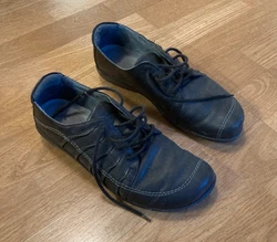 This is a pair of black Tanguru lace-up shoes by Naot. From a house with cats.