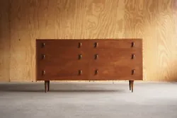 item-Original Glenn of California Walnut Dresser designed by Stanley Young, circa 1960. Six drawer dresser completely...