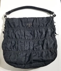 Manufacturers product #BR3750. Made in Italy. Features a magnetic closure. Classic black Prada logo lining. Slip and...