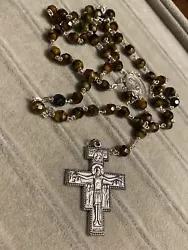 vintage silver tone rosary necklace with amber brown colored glass beads. This is a pre-owned item and may show normal...