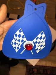 MUDFLAP IN BLUE WITH BLUE & WHITE CHECKERED CROSS FLAGS AND RED JEWEL YOU GET ONE MUDFLAP IN BLUE OR RED OR WHITE OR...