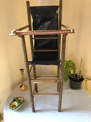 Rare old doll high chair. Made of wood and can see the old green paint which has largely worn away. The seat is what I...