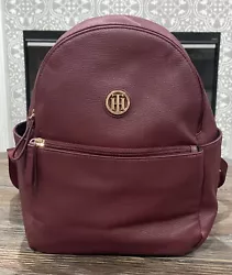 Beautiful Tommy Hilfiger Backpack-style Purse. Pebbled Burgandy or Garnet color. Has zippered compartment on the front,...