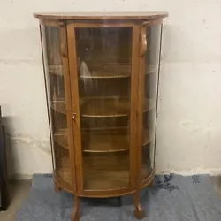 This antique 60x34in wooden cabinet is a rare find for collectors. The beveled glass adds a touch of elegance to this...