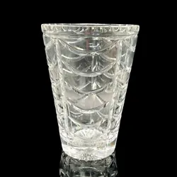 Beautiful cut and polished crystal vase in a conical shape decorated with draping swags alone the sides, a sunburst at...