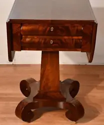 This table is made of crotch Mahogany wood, featuring a drop leaf sides that would open up to make a larger surface,...