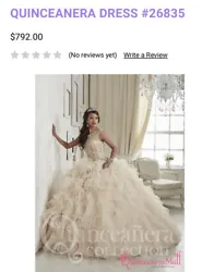 Quinceañera dress. Glimmering embroidery dipped in gold and wavy tulle flecked in sparkle like stars across a skirt...