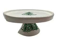And around the bottom cake stand. White with green Christmas trees around top of plate. Made in Italy.