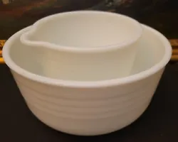 Two PYREX Hamilton Beach mixing bowls in nice condition. One marked 36, the other with pouring spout. Both are ribbed...