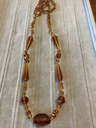 vintage art deco faceted amber topaz glassed hand knotted beaded necklace. this is a pre-owned item from an estate sale...