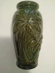 Vintage tropical themed vase with raised palm tree design. 7.5