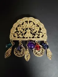 Ornate Gold Tone Brooch With Dangling Charms. Great condition. No obvious brand markings. Unique piece.