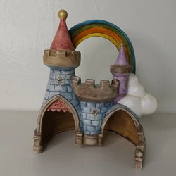 This is an exceptional piece. This LARGE ceramic castle is nearly nine inches tall. Beautifully painted, the clouds...