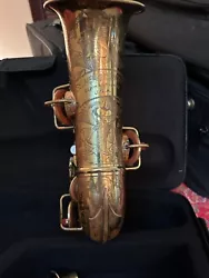 This is a Selmer American which is a Buescher Stencil. It is a higher end 1920s sax with incredible engraving. The horn...