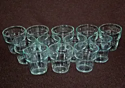 Collection of 12 clear glass votive holders. - 2-5/8