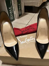 Elevate your footwear game with these stunning Christian Louboutin Decollete black patent heels. The iconic brand is...