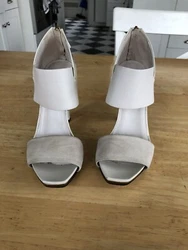 Gucci Italy Sandals with ankle Strap. Patent leather with suede front band, golden trim on sole edges. Buckle closure.