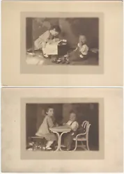 Young Girl & Boy at Toy Desk Two New York 1910s Studio Photos. Two silver photos, each 7”x10” with wide...